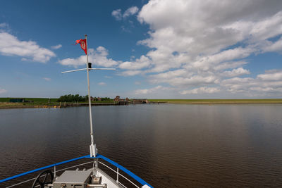 Cropped image of boat in sea against sky