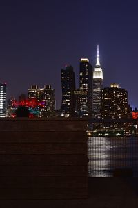 Illuminated buildings in city at night