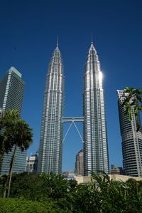 Low angle view of buildings against blue sky