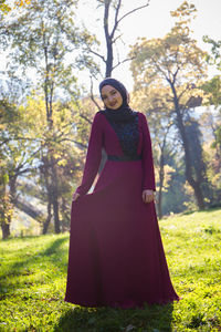 Full length of woman standing on field