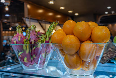Close-up of orange fruits in glass