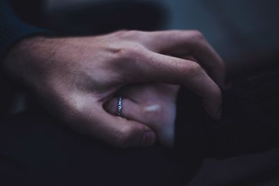 Close-up of couple holding hands