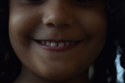 Cropped image of smiling girl