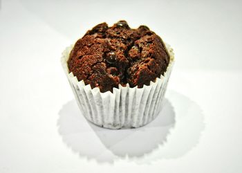 Close-up of pastry against white background