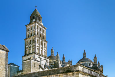 Low angle view of building against blue sky