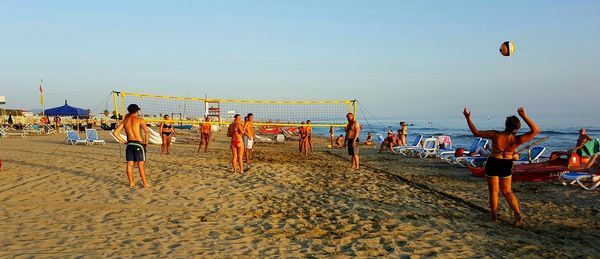 People playing on beach