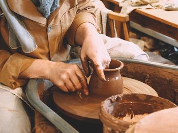 Craftsperson making pottery