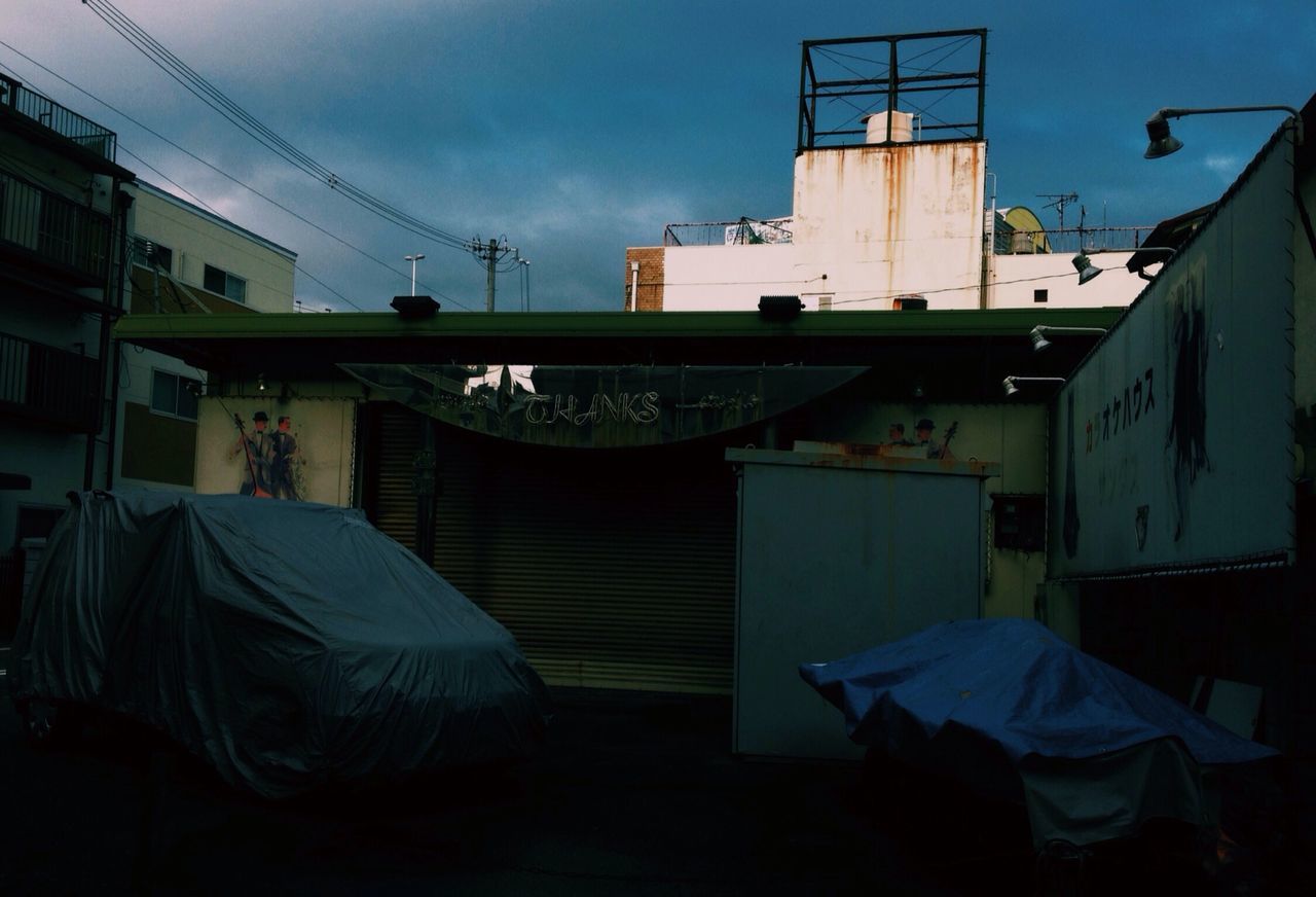 architecture, built structure, building exterior, sky, house, residential building, residential structure, no people, day, outdoors, building, low angle view, sunlight, absence, cloud, drying, blue, town, window, cable