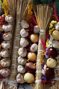 Close-up of onions and garlic at market