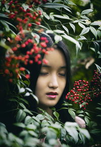 Chinese girl among red berries ii