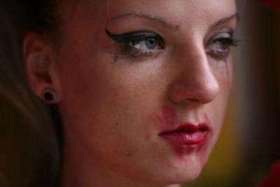 Close-up of woman with smudged make-up