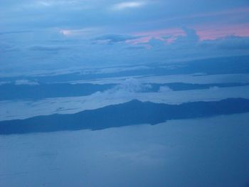 Scenic view of landscape against cloudy sky