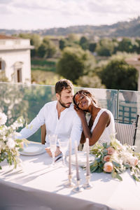 Couple kissing on table