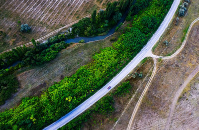 High angle view of highway amidst trees in city