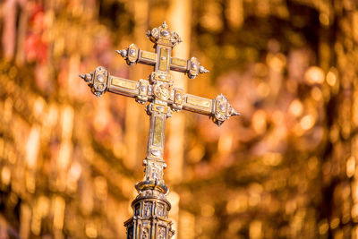 Close-up of cross sculpture