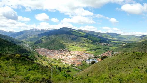 Scenic view of landscape and mountains against sky