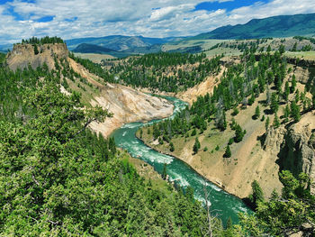 High angle view of river amidst landscape against sky