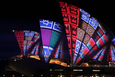 Low angle view of illuminated lights at night