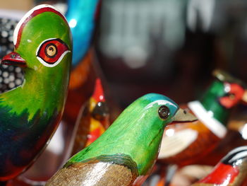 Bird figurines for sale at market stall