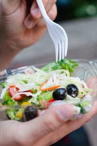 Midsection of person holding food