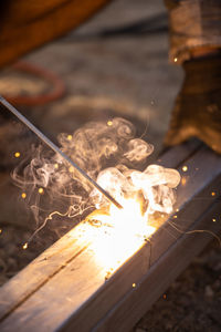 Close-up of burning fire on wood