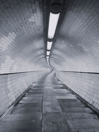 Low angle view of empty subway tunnel