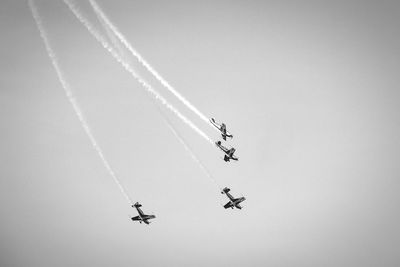 Low angle view of airplane flying in sky