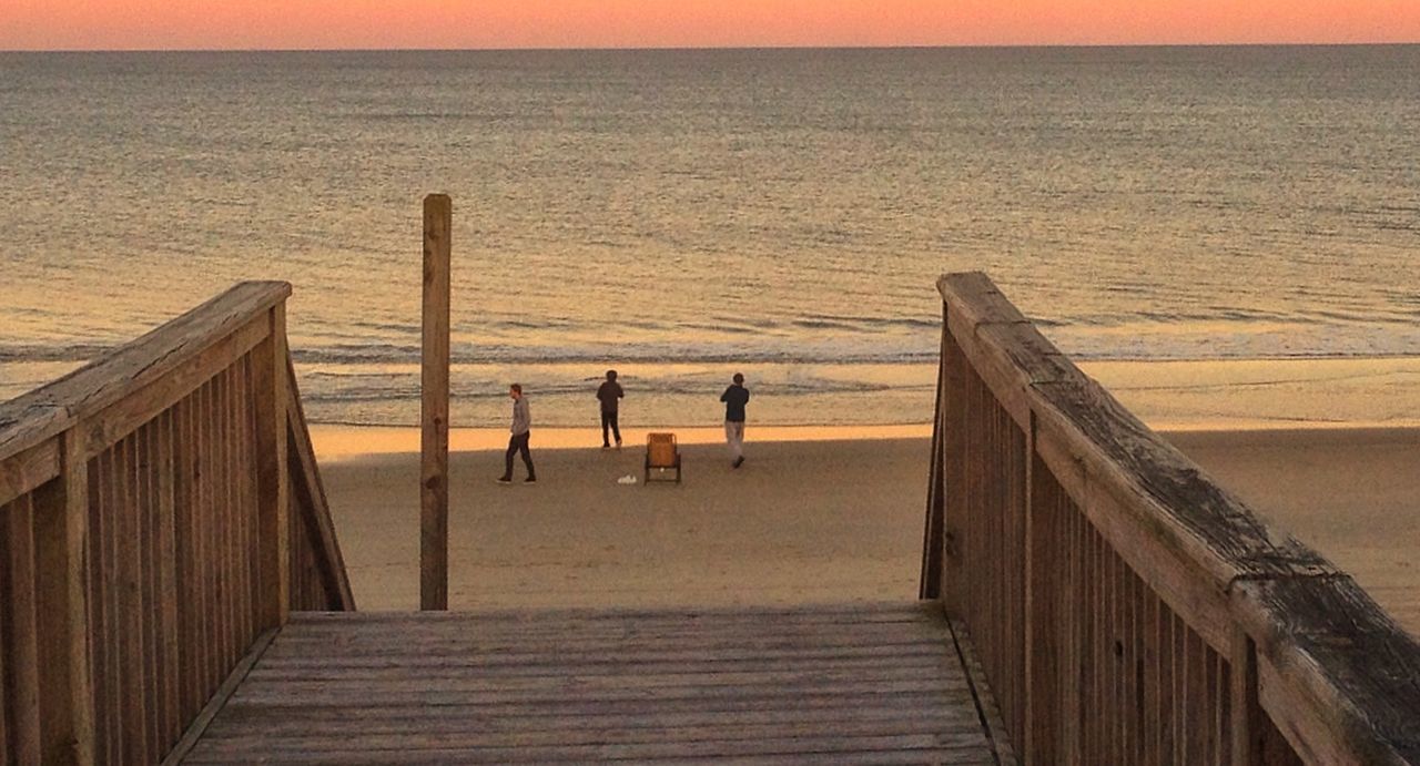 sea, water, horizon over water, pier, sunset, scenics, wood - material, tranquil scene, tranquility, beauty in nature, jetty, beach, nature, sky, idyllic, railing, built structure, wooden, wood, boardwalk