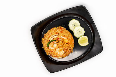 High angle view of food in bowl against white background