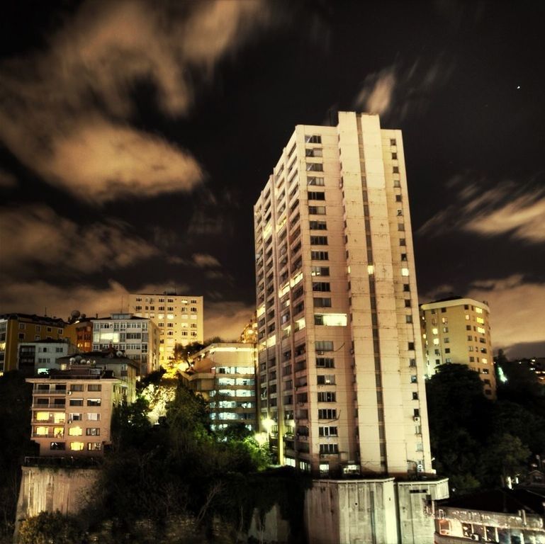 building exterior, architecture, built structure, sky, city, cloud - sky, cloudy, residential building, low angle view, overcast, skyscraper, building, tower, modern, dusk, tall - high, residential structure, weather, storm cloud, cityscape