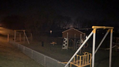 Staircase by building against sky at night