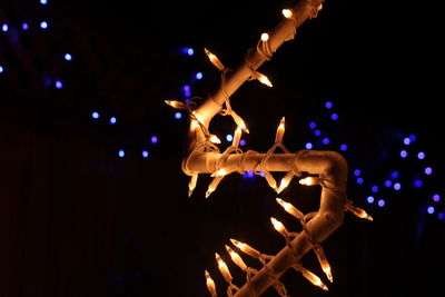 Low angle view of woman at night