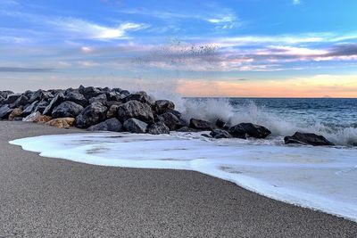 Scenic view of sea against sky during sunset