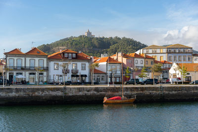 Viana do castelo city with boats and santa luzia chruch sanctuary on the hill, in portugal