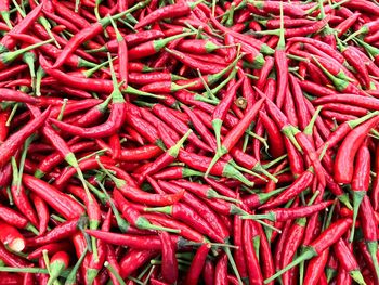 Full frame shot of red chili peppers for sale at market