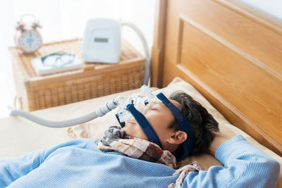 Man lying down on bed