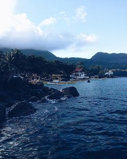 Scenic view of sea against cloudy sky