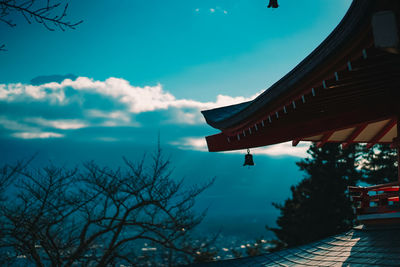 Traditional building against sky at dusk