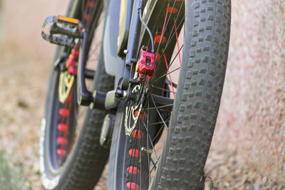 Close-up of bicycle parked on field