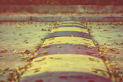 Close-up of speed bump on road