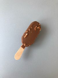 Close-up of ice cream cone against white background