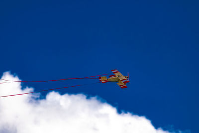 Low angle view of ski against clear blue sky