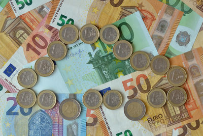 High angle view of coins on table