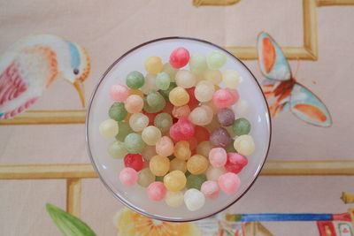 High angle view of multi colored candies on table