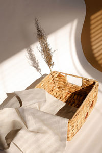 Close-up of text in wicker basket on table 