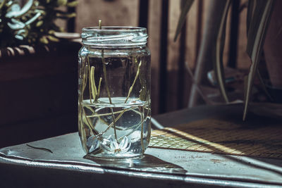 Close-up of drink in glass jar on table