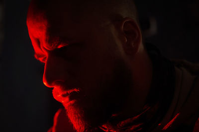 Close-up portrait of young man looking away