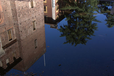 Reflection of buildings in puddle