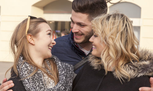 Close-up of young couple kissing outdoors