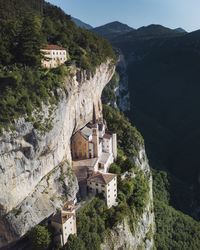 Buildings against mountain range